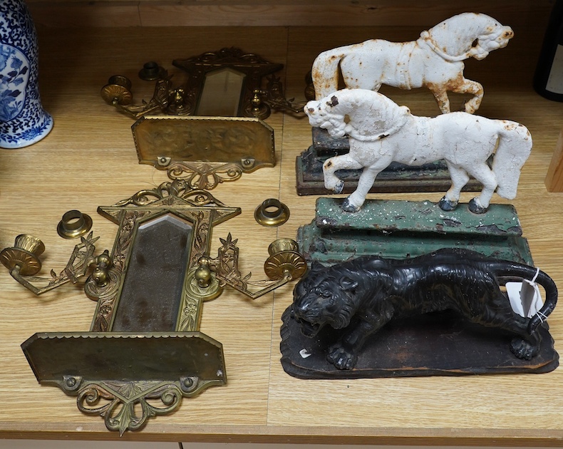 A Chinese spelter model of a tiger on hardwood plinth, a pair of Victorian painted cast iron ‘horse’ door-stops and a pair of brass two branch wall sconces, 37cm. Condition - fair